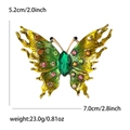 Elegante spilla a farfalla in lega dorata con cristalli colorati e ali in smalto - Verde