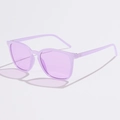 Detail view of purple translucent resin sunglasses with matching tinted lenses in soft light - Jelly Purple