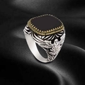 Macro detail of men's vintage signet ring with black stone and eagle pattern - US 7 / Eagle Totem