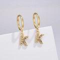 Detail of gold huggie hoop earring with K letter pendant inlaid with clear crystals - Letter K (Style: 0229)