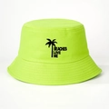 Close-up of neon green bucket hat featuring black palm tree and BEACHES LOVE ME text - Fluorescent Green