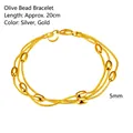 Macro detail of triple-strand gold bracelet showing olive beads and 20cm length dimension - Gold