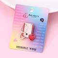 Macro detail of a medical brooch with stethoscope and red heart on display card - Medical Theme Set