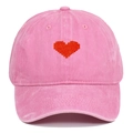 Close-up of pink washed cotton baseball cap featuring red pixelated heart embroidery - Pink