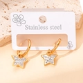 Eleganti orecchini a stella in acciaio inossidabile dorato con strass brillanti decorati - Orecchini Pendenti a Stella con Strass