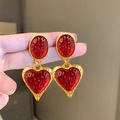 Vintage golden earrings featuring oval and heart red resin stones with textured surface - Oval Heart Stud / Red