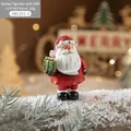 Resin Santa Claus figurine holding a green gift box for Christmas desktop decoration - Small Santa Claus Style C (Holding Green Gift Box)