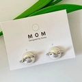 Elegant silver Saturn planet stud earrings with polished metallic finish on jewelry card - Silver Planet Saturn Shape Stud