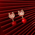 Close-up of Chinese New Year earrings with golden Fu character and red beads - 25# Red - Fu Symbol Dragon Horn (Silver Earring Post)