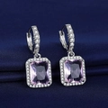 Silver square earrings with pink-purple gemstones and diamond-set halo on blue fabric - Pink Diamond Earrings Led-112