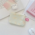 Floral cat pattern coin purse on a desk with laptop and headphones detail shot - Printed Cat Green