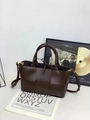 Deep brown woven leather tote bag with dual handles and adjustable shoulder strap - Coffee