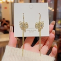 Detail of golden bow tassel earrings with S925 silver needle and sparkling rhinestones - Gold Bowknot Tassel