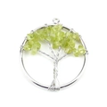 Detailed view of Tree of Life pendant with silver wire and green crystal stones - 3cm / Silver + Peridot