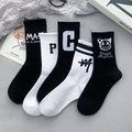Five-pack of black and white cotton crew socks with athletic stripes and graphic prints - Numbered Combination Style