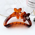 Amber floral hair claw clip with frosted semi-circular design in dark brown finish - Amber Red