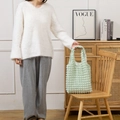 Close-up of light green bubble texture shoulder bag with soft quilted waffled fabric - Light Green