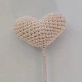 Handmade crochet heart fairy wand in beige and pink yarn with soft knitted texture - Nude