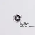 Detail of flower charm with black enamel petals and crystal border on white background - Style 8 Flower / Silver