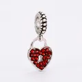 Macro shot of a silver heart lock charm with red crystals and beaded hanging loop - 16-Heart Lock