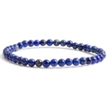 Macro detail of 6mm natural lapis lazuli round beaded elastic bracelet with gold flecks - Lapis Lazuli