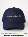 Detailed close-up of white 'Made in Brazil' embroidery on a navy cotton baseball cap - Adjustable / Navy Blue