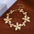 Elegant gold tulip flower bracelet with textured petals on a luxury velvet background - Flower Bracelet (12242) / KC Gold