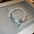 Detail of beaded bracelet with cat eye stones and sparkling zircon star pendant - Blue Cat Eye Stone Bracelet
