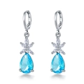 Elegant silver pear-shaped light blue stone earrings with zircon floral accents on white background - Sea Blue Rhinestone