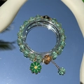 Handmade beaded bracelet with green translucent stones and gold flower pendant detail - S060-light Green Daisy Bracelet #sz532
