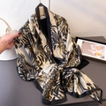 Leopard print silk satin long scarf with wide black border shown flat on a grey surface - Leopard Black / 180*80cm
