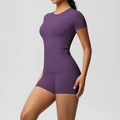 Detail of purple high-stretch yoga set with slim fit short sleeves and matching shorts - S / Top And Bottom / Dark Purple