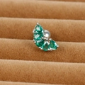 Macro view of green pear-cut zircon cartilage stud earring on brown velvet display - Pear-Shaped Design (E1357-4)