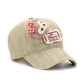 Detail of denim baseball cap featuring a plush character patch and a red plaid bow - One Size / Khaki