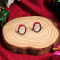 Handmade wooden Santa Claus stud earrings on festive wood block and red background - Santa Claus