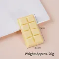 Creamy yellow chocolate PVC keychain charm 6cm x 3.5cm on a white ceramic plate - Model Style (No Buckle) / Light Yellow