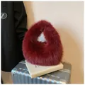 Furry burgundy plush handbag made of faux fox fur in a stylish triangular shape - Burgundy
