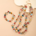 Detail of colorful irregular shell beads and gold spacers on bohemian necklace set - Irregular Shell Set / Colorful
