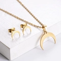 Golden moon pendant necklace and stud earrings set with a polished metallic finish - Moon