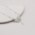 Silver butterfly necklace with heart pendant on ceramic plate, elegant jewelry design - Butterfly Style (LI359)