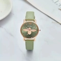 Detail of green quartz watch face featuring a gold bee and Roman numeral markers - Green