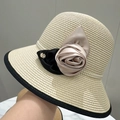 Detail of straw hat with satin rose, black bow, and pearl embellishments on beige weave - M (56-58cm) / Beige