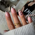 Almond-shaped nude pink fake nails with white French tips and small black heart accents - Bz1760 Foundation Ink Core / Glue Type