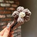 Brown crochet flower hair clip with cream center on a yarn-wrapped metal barrette - 050 Knitted Flower - Dark Coffee