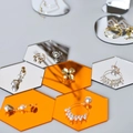 Hexagonal mirror tray displaying gold jewelry with pearls and flower stud earrings - Hexagon 3-Piece Set