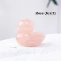 Rose quartz gemstone carved in a cute duck shape with smooth polished finish and pink tones - Rose Quartz
