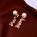 Detailed view of golden leaf earrings with shimmering rhinestones and white pearls - Gold White Leaf Pearl Style (67#)