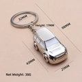 Polished silver zinc alloy F1 racing car keychain with metal ring and white window detail - X-336 SUV Car