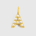 Detailed view of a gold-plated letter A pendant with inlaid white pearls and top ring - Gold-A