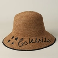 Handwoven raffia sun hat with star embroidery and Celeisite text in deep beige - M (56-58cm) / Khaki